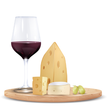 Käseplatte mit einem Glas Wein und Weintrauben